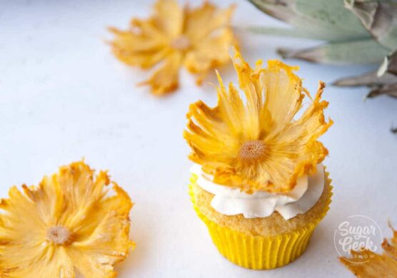 Decorate cupcakes with dried pineapple flowers