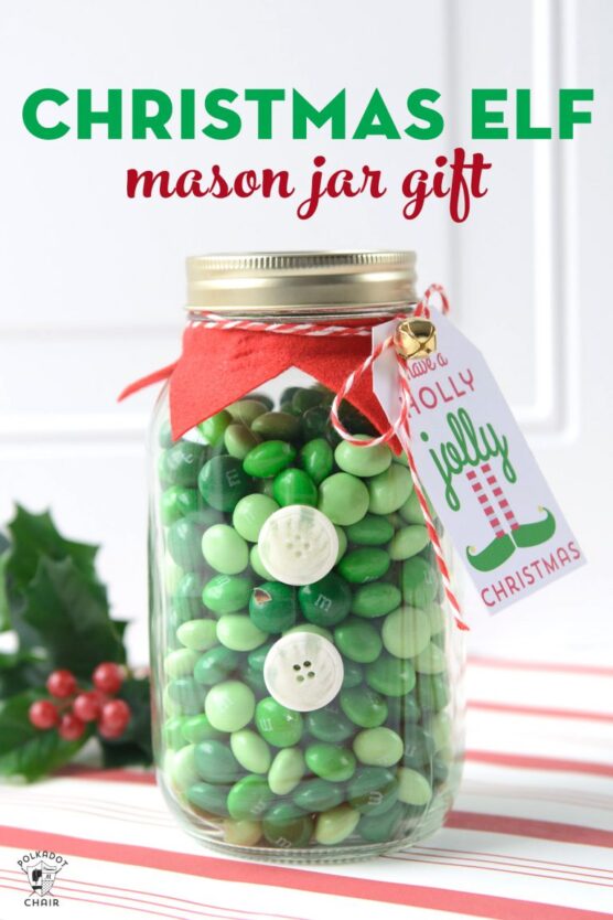 Green M&Ms inside a decorated glass jar 